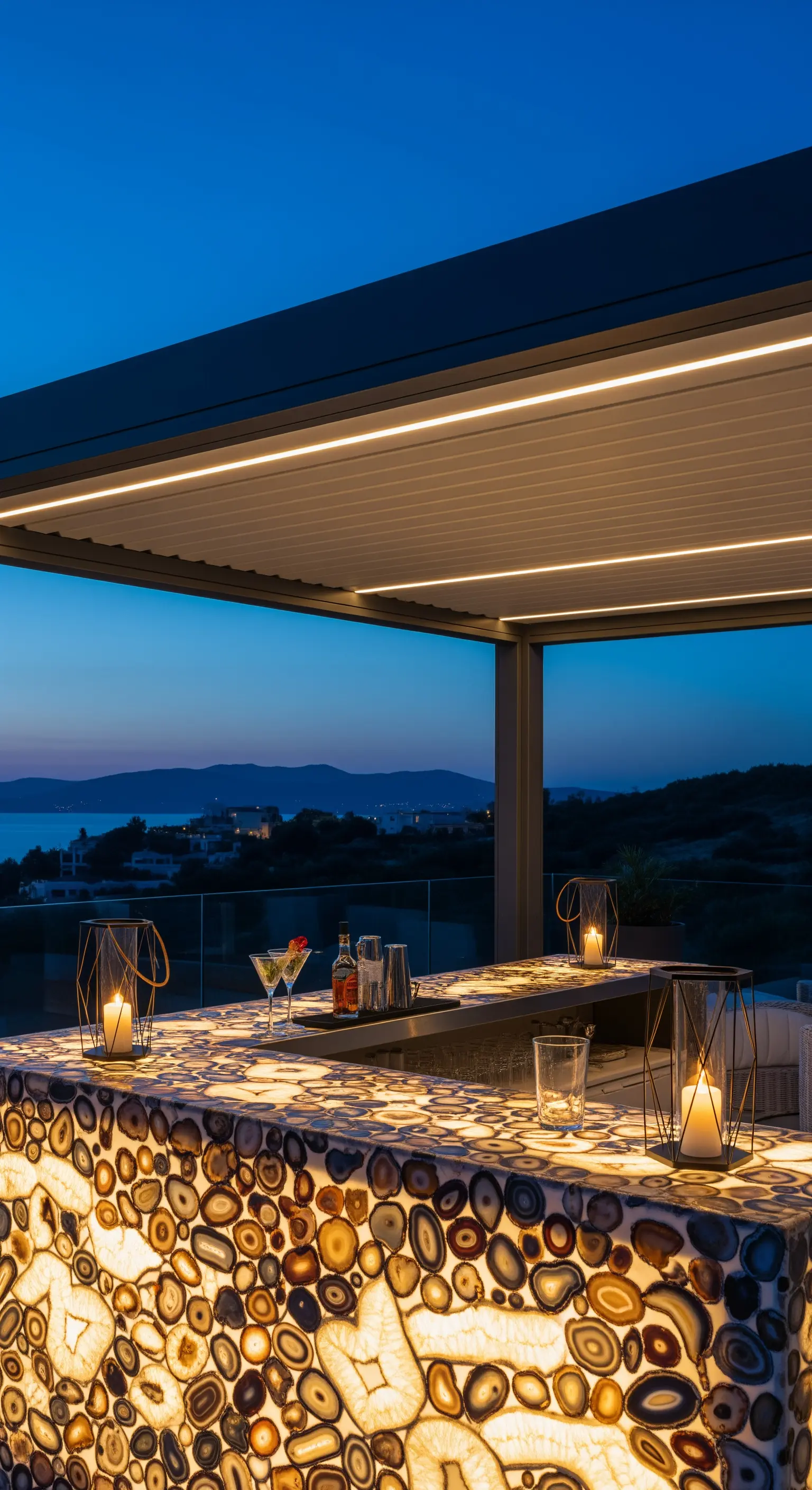 Moderno bancone bar da esterno realizzato in agata retroilluminata, che brilla al crepuscolo