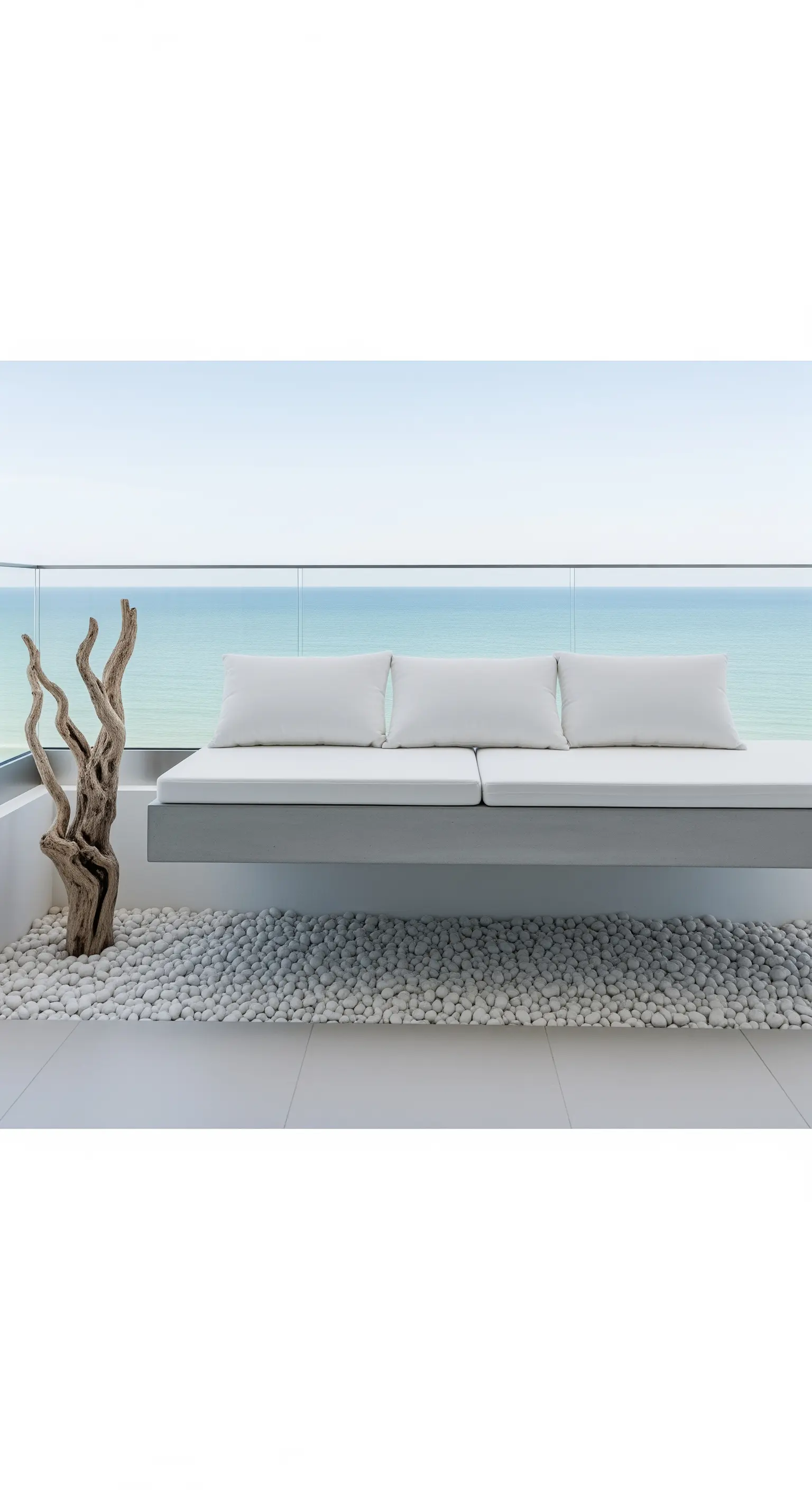 Balcone minimalista con panca sospesa grigia, ciottoli bianchi e una scultura in legno naturale.